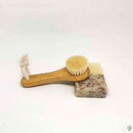 Soft Detox & Glow Face Brush with bamboo handle and goat bristles, paired with a natural soap bar, ideal for gentle exfoliation.